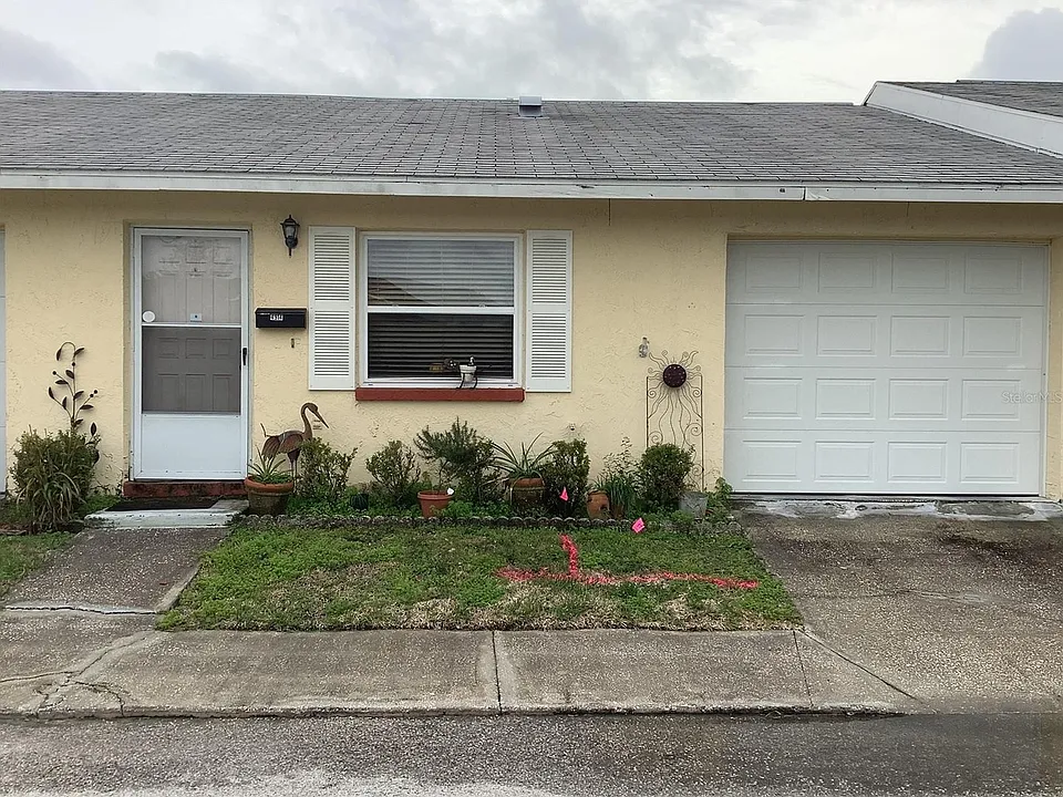 Front of unit displaying garage.