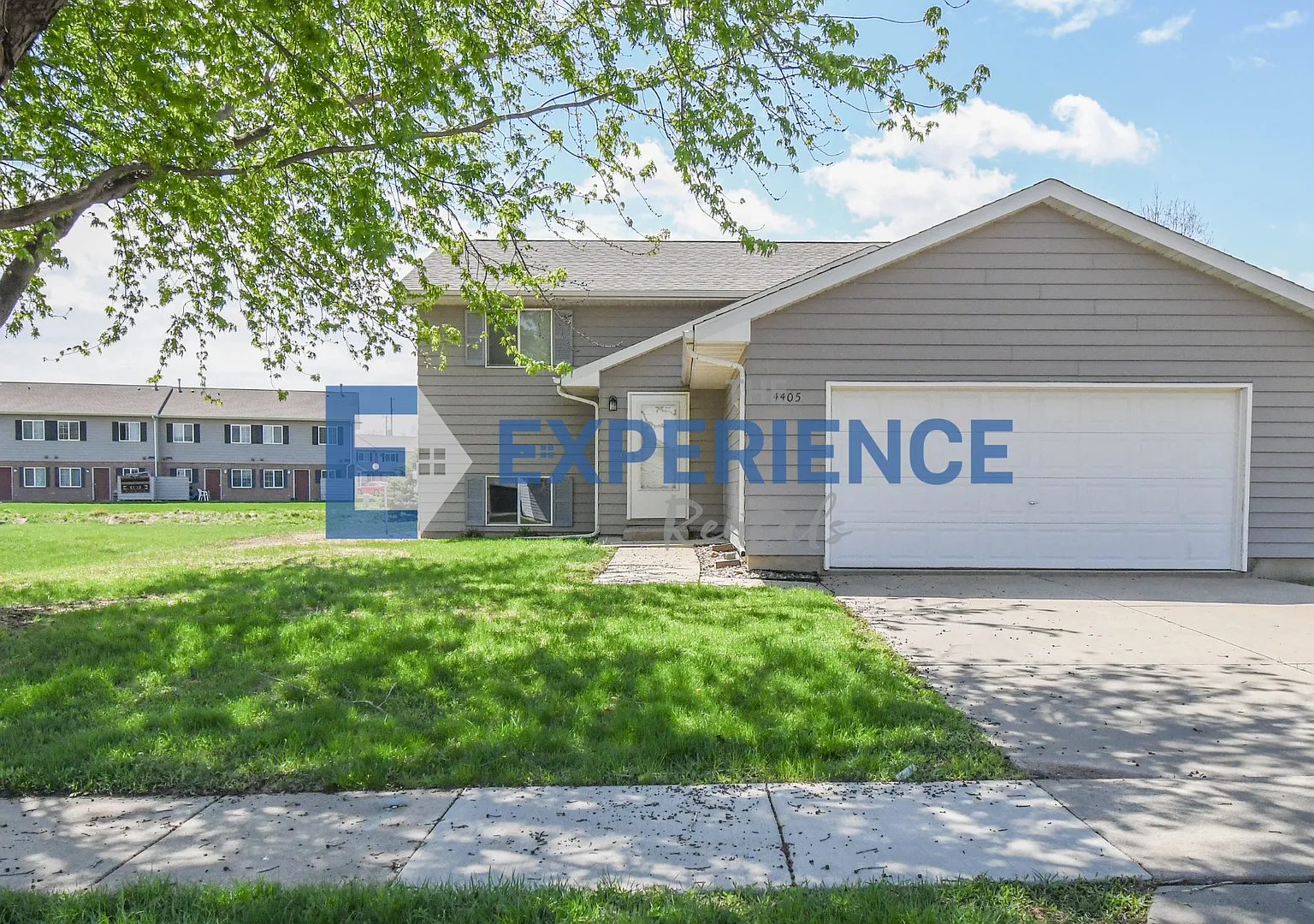Updated 3BR Split-Level Home with Huge Deck, Fenced Yard & 2-Car Garage Near I-29! — Photo 1