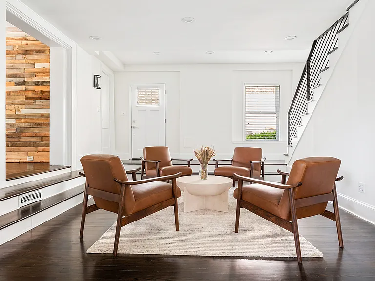 New leather chairs and plush carpet for entertaining and connecting with guests.