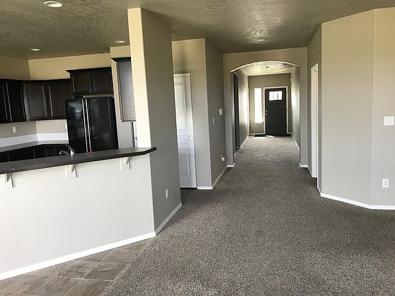 Long hallway view from living room to front door
