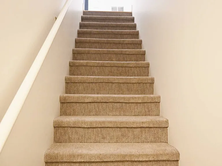 Staircase going to the second floor in a townhouse at The Sawyer.