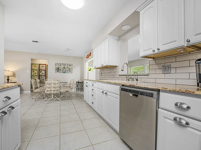 Large dining area with coffee bar opening to family room