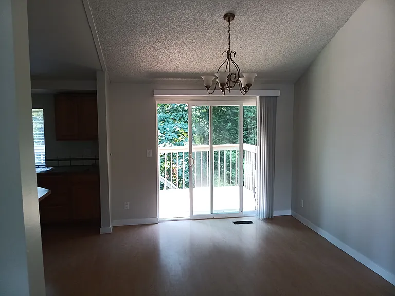 Dining room overlooking greenbelt/backyard. View of Mount Rainier off deck.