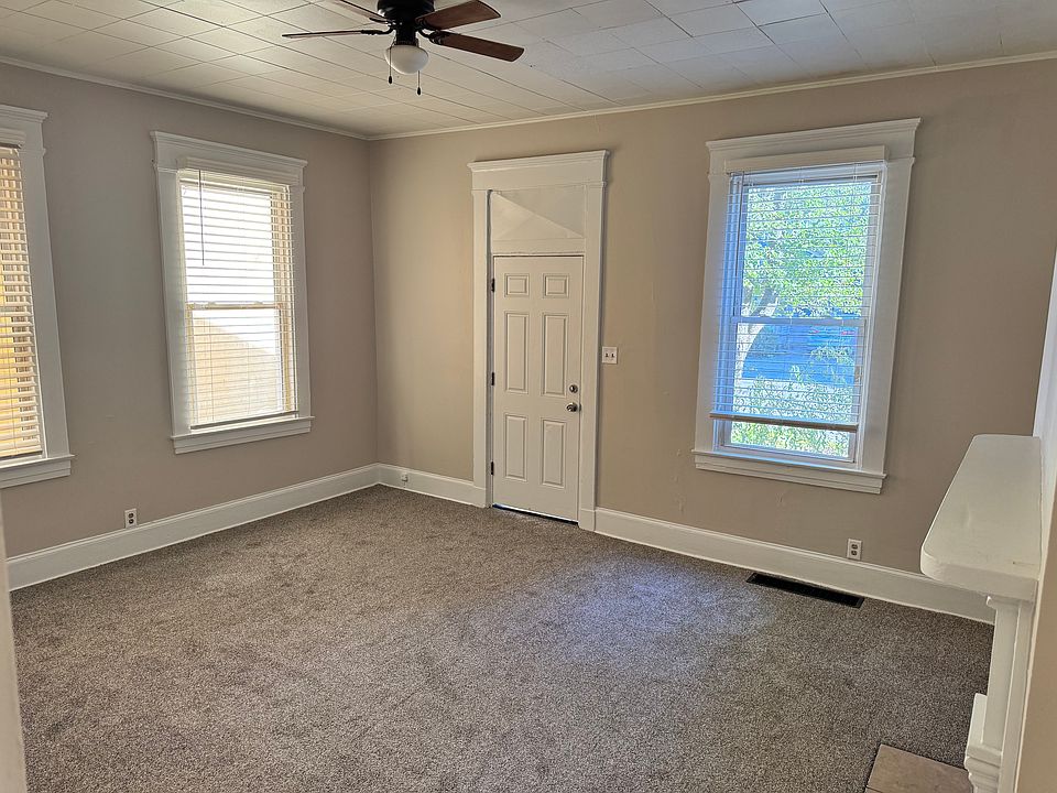 Looking at the front door from inside. New carpet and freshly painted as well. Oversized molding throughout.