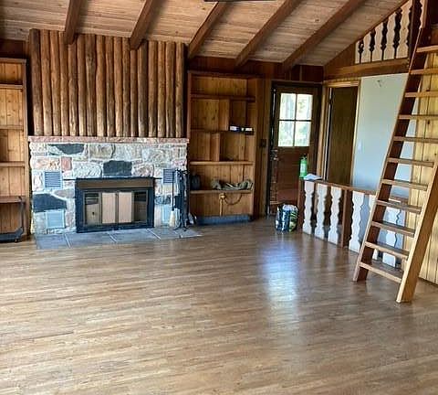 Upper open area, new high efficiency wood stove insert now replaces fireplace