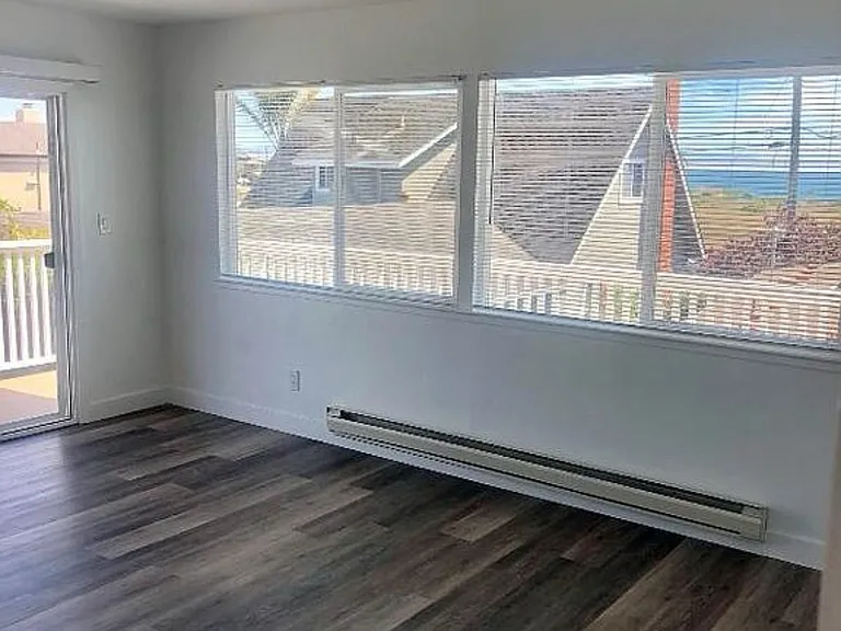 Primary suite with slider to deck and ocean views