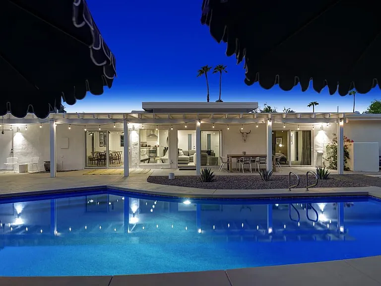 expansive backyard /pool area nighttime