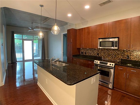 2nd image of 711 Cosmopolitan Dr NE Unit Tl4