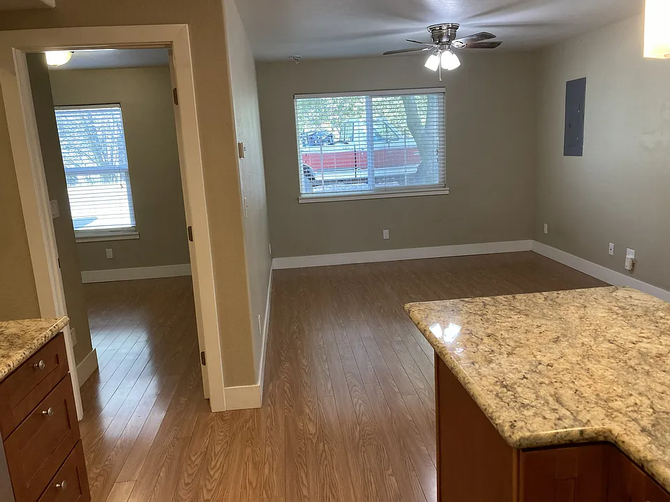 bedroom and living room as seen from the kitchen