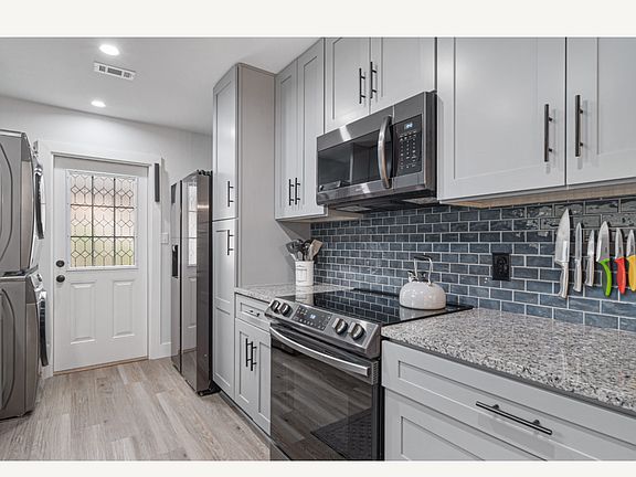 All stainless steel appliance with pull out drawers versus cabinets.