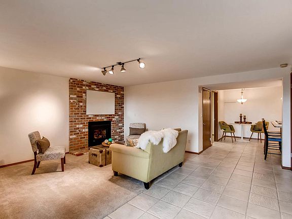 Living Room with fireplace. Photo taken from front door.
