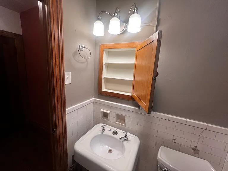 Original medicine cabinet and updated lighting.