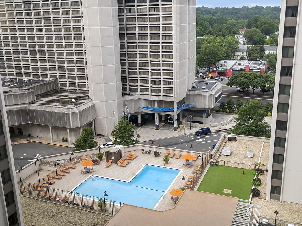Sparkling Pool with Expansive Sundeck and Tanning Areas