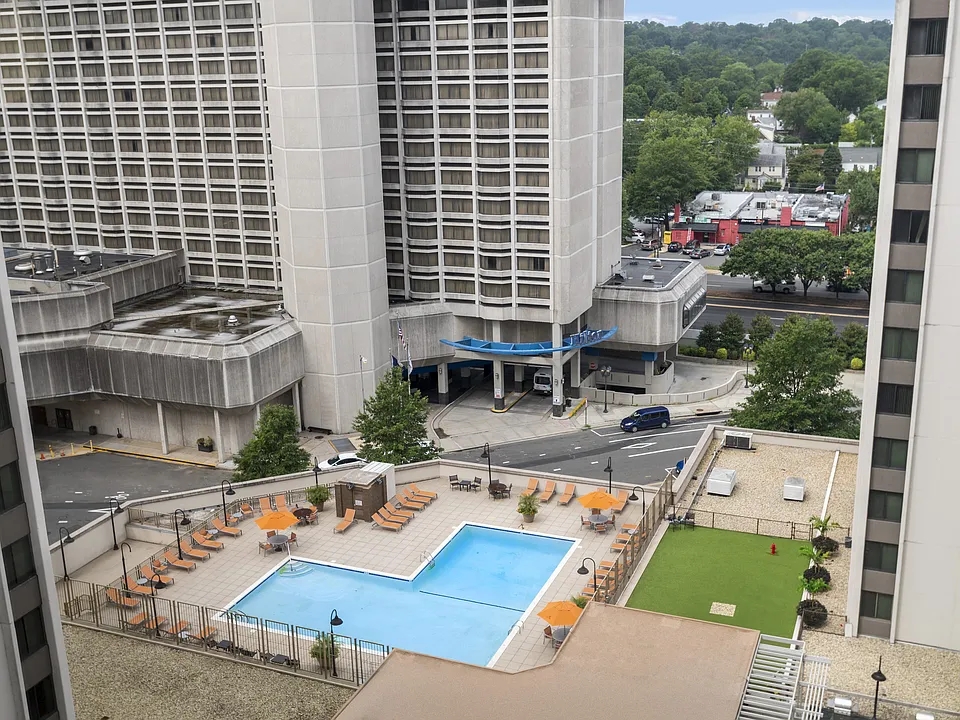 Sparkling Pool with Expansive Sundeck and Tanning Areas