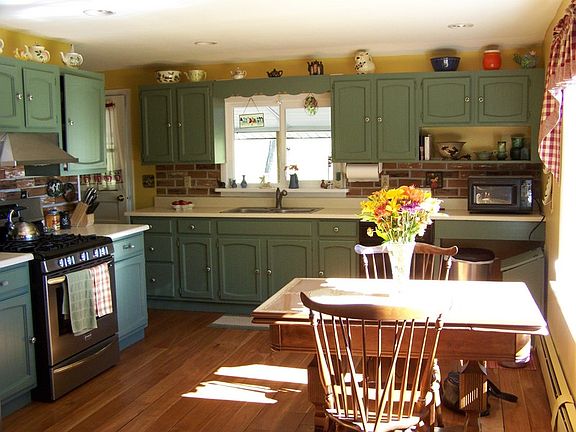 kitchen
						:
						Cherry floor, stainless steel refridgerator and stove