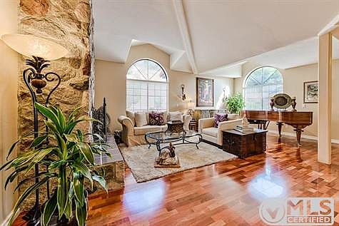 Tropical hardwood floors with titanium oxide finish shine in the formal living room! Space perfect for grand piano, art & statement pieces.