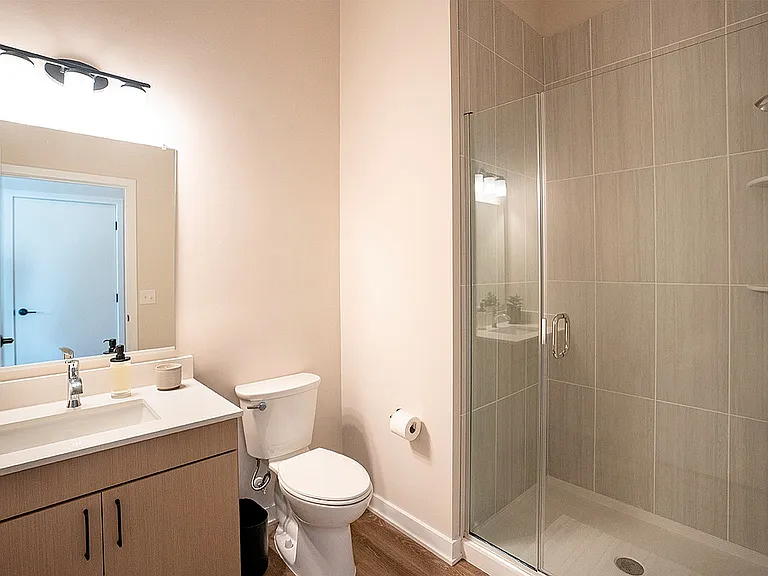 Experience luxury in this bright and modern bathroom with elegant fixtures.