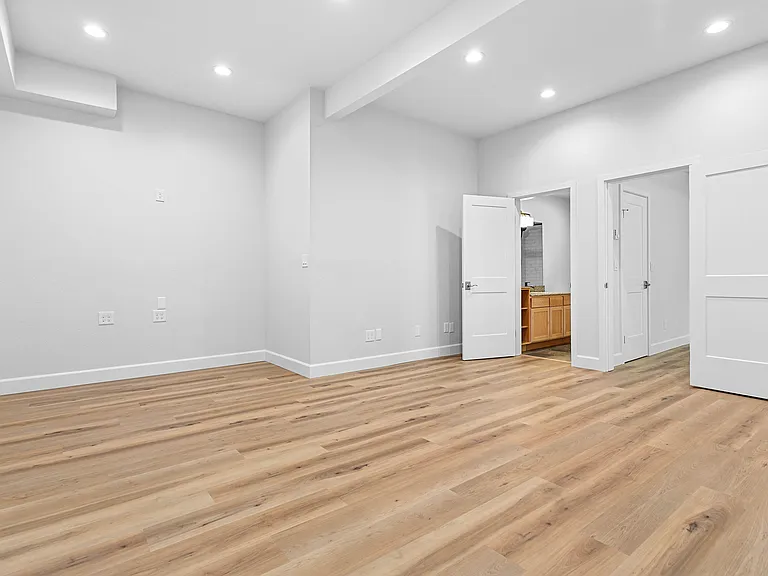 Living room/TV room. Doors to bathroom and bedroom.