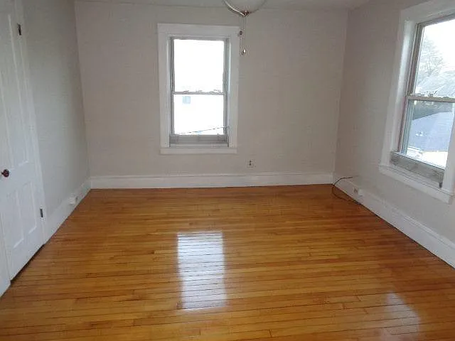 This is the living room. It has a closet, and two windows. Lots of light during the day!