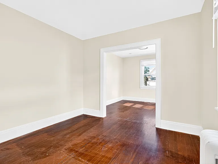 Bedroom with hardwood floors.