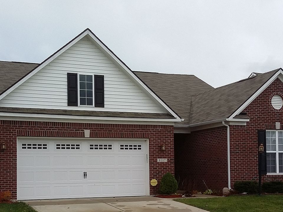 Landscaped gardens at front of house.