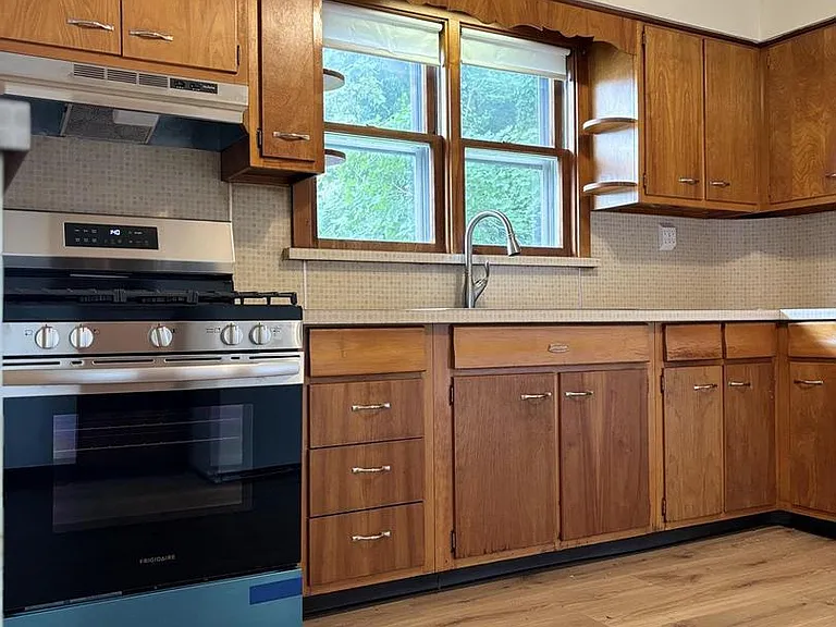 Gas Stove and sink overlooking window