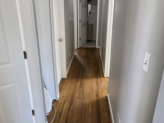 Hallway to 4 bedrooms and Kitchen