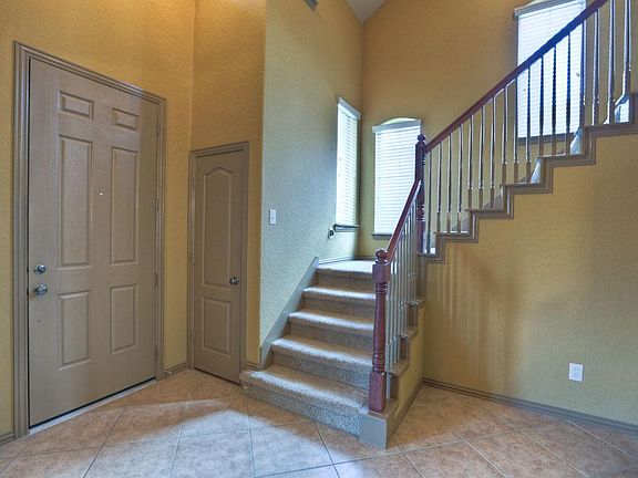 You Will Feel Right at Home The Moment You Step into This Bright, Two Story Entryway Boasting Crown Moulding, Upgraded Fixtures and Custom Paint!