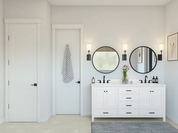 Primary bath featuring freestanding vanity with dual sinks