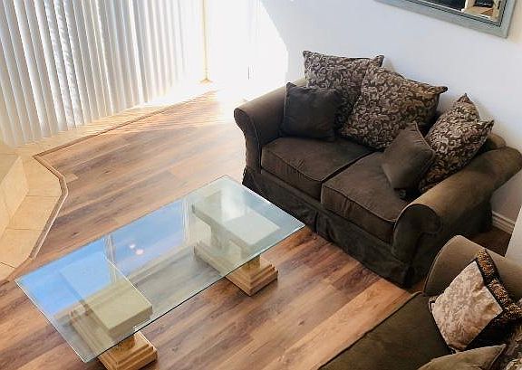 View from the 2nd floor overlooking the living room. NEW hardwood floors!