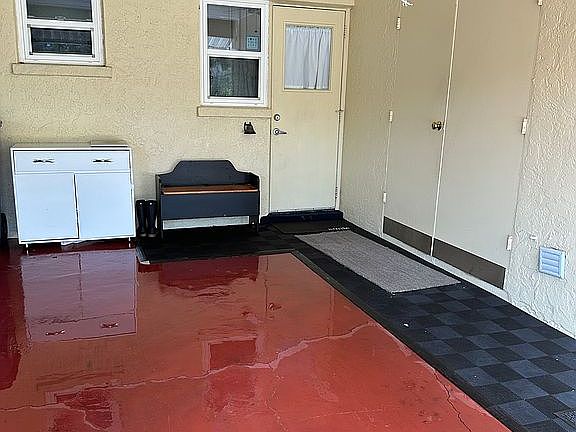 Carport door to villa