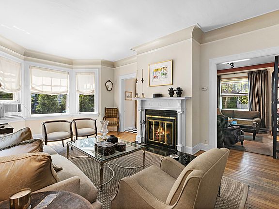 Livingroom with big windows and a fireplace