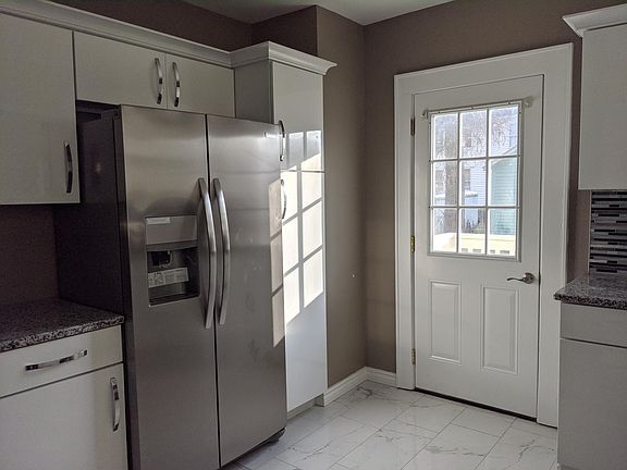 Pantry, icemaker and water dispenser and rear exit.