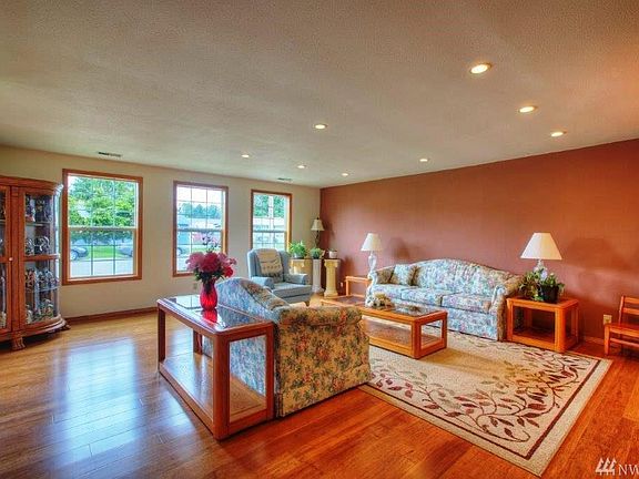 Formal Living Room With Lot's Of Double Pane Windows Bringing Light.