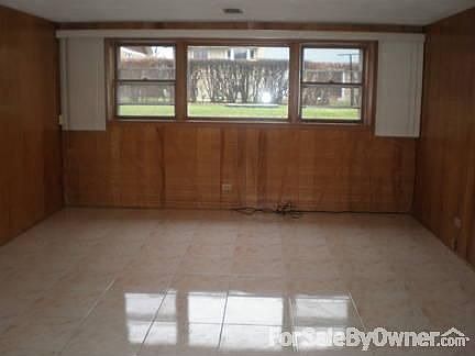 FAMILY ROOM LOOKING OUT TO BACK YARD