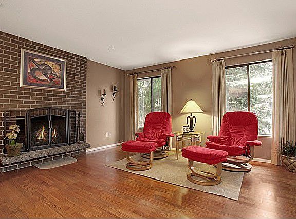 Brick Fireplace adds cozy touch to living room.