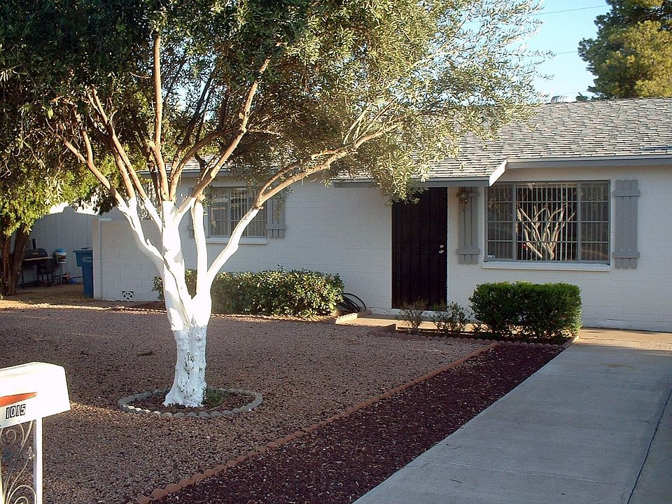 Front with 2 mature trees