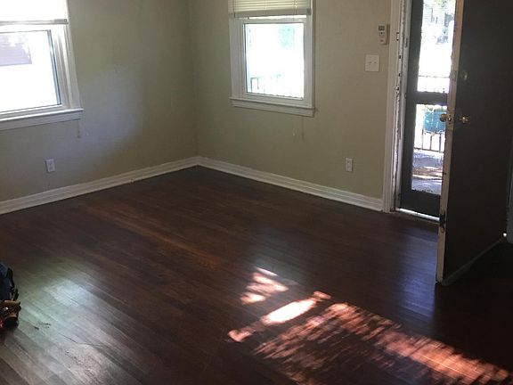 Generous sized living room open to front porch.