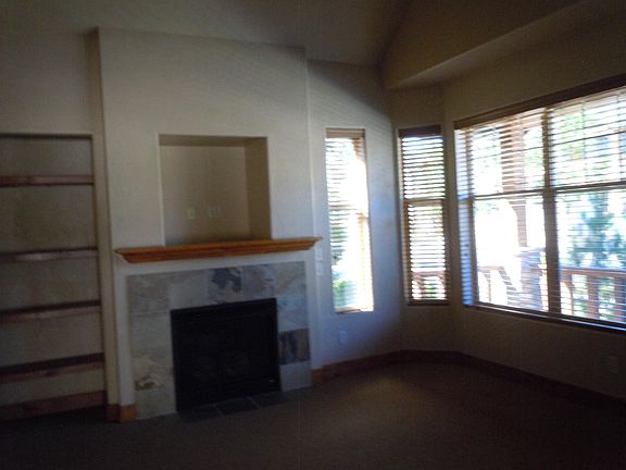 Carpeted Family Room with Gas Fireplace