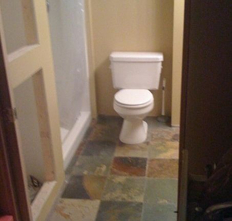 Lower level 3/4 bathroom with slate tile