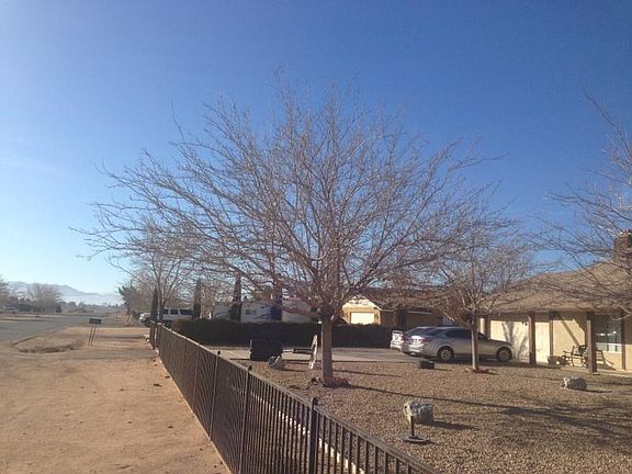 This house is near schools and shopping and completing fenced in.on over 1/2 acer acher of lot