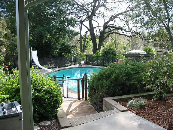 View down to pool from patio