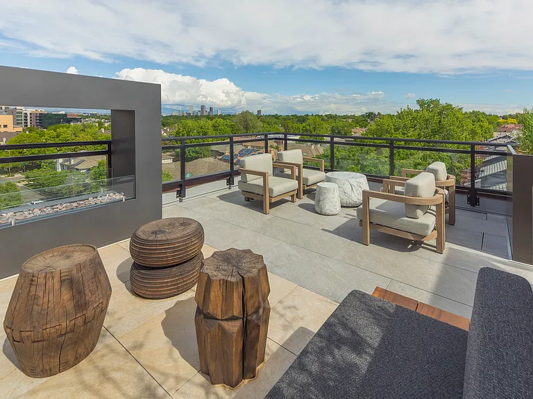 Elevate your outdoor experience in our community's rooftop seating area