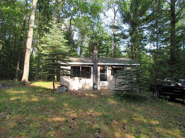Hunters retreat: Two wooded lots with a one bedroom, one bath cabin. Good size kitchen and living room. Laundry room with washer & dryer. Furnishings stay with full price offer.