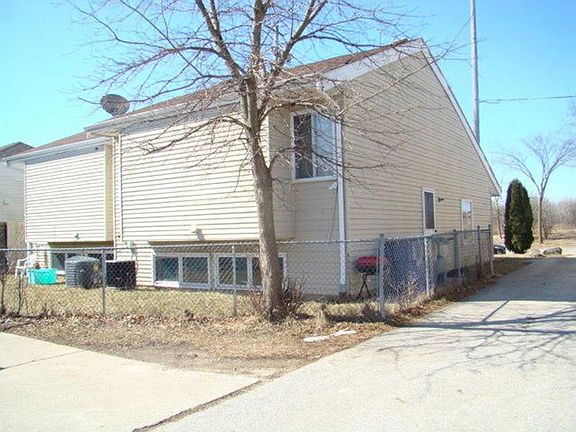 Rear of unit with shared fenced in yard