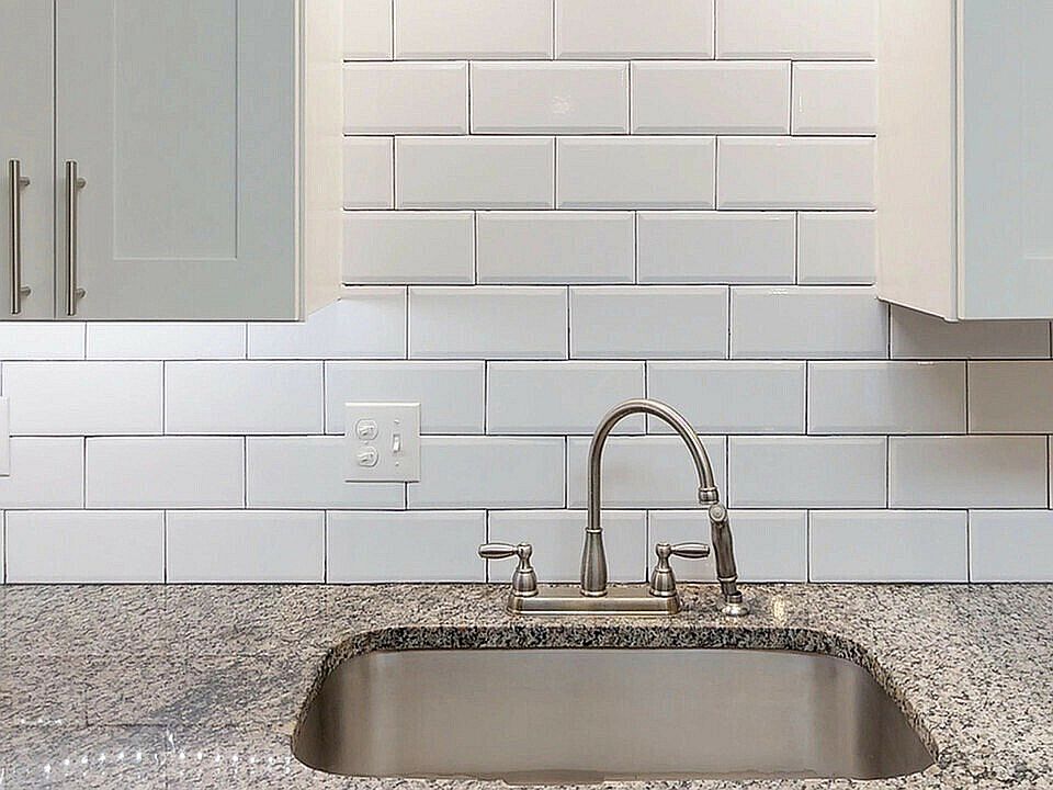 Experience the elegance of modern kitchen design with this stylish setup.