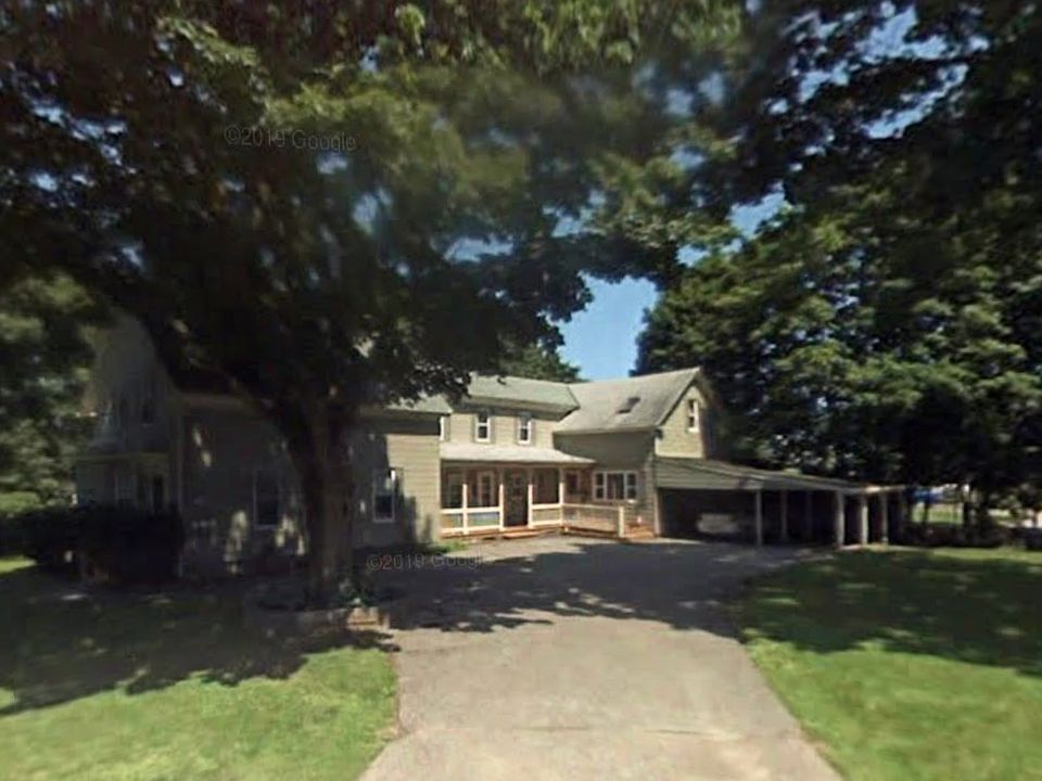 Exterior during summer. Tree on left was removed since photo.