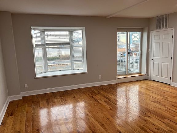 living room Note: patio and view of bridge through glass sliding door.