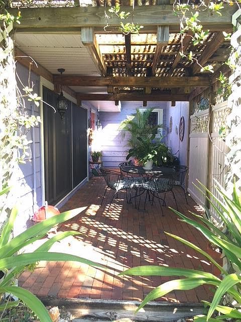 Private large brick covered patio with outside dining