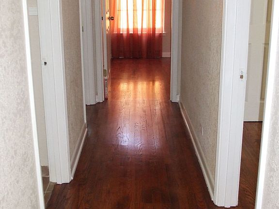 Hallways to the bathroom and 3 bedrooms.